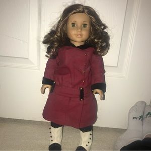 American girl doll and her original outfit.
